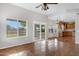 Bright, open living area featuring large windows and kitchen access at 9665 E Nido Ave, Mesa, AZ 85209