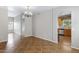 Open living area with tile floors, and access to the kitchen at 9665 E Nido Ave, Mesa, AZ 85209