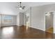 Expansive living room area showcasing hardwood floors, neutral decor and vaulted ceiling at 9665 E Nido Ave, Mesa, AZ 85209