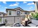 Inviting balcony features stylish seating and views of well-maintained neighborhood homes at 9906 E Wavelength Ave, Mesa, AZ 85212