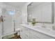 Bright bathroom featuring a glass shower, double sink vanity, and modern fixtures at 9906 E Wavelength Ave, Mesa, AZ 85212