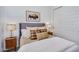 Cozy bedroom featuring a comfortable bed, stylish lamps, and a decorative buffalo artwork at 9906 E Wavelength Ave, Mesa, AZ 85212