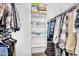 Organized walk-in closet with hanging clothes and shelving, offering ample storage space at 9906 E Wavelength Ave, Mesa, AZ 85212