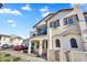 Beautiful two-story home featuring a balcony with outdoor seating at 9906 E Wavelength Ave, Mesa, AZ 85212