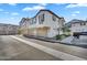 View of modern townhomes featuring clean architecture, two-car garages, and landscaped front yards at 9906 E Wavelength Ave, Mesa, AZ 85212