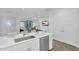 Modern kitchen with stainless steel appliances, a breakfast bar island, and an open view to the living area at 9906 E Wavelength Ave, Mesa, AZ 85212
