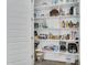 Organized walk-in pantry with white shelving, providing ample storage space for food and kitchen essentials at 9906 E Wavelength Ave, Mesa, AZ 85212