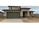 Well-maintained single-Gathering home featuring a spacious two-car garage and a desert landscape at 15146 W Gray Fox Trailer, Surprise, AZ 85387