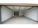 Spacious and well-lit two car garage featuring white walls and a concrete floor at 15146 W Gray Fox Trailer, Surprise, AZ 85387
