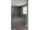 Cozy bedroom with neutral walls and ample natural light from a window at 15151 W Gray Fox Trl, Surprise, AZ 85387