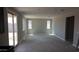 Spacious living room with sliding glass doors, and windows at 15151 W Gray Fox Trl, Surprise, AZ 85387