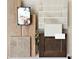 A curated selection of interior design materials including flooring, tile, and cabinetry samples in neutral tones for a modern home at 15151 W Gray Fox Trl, Surprise, AZ 85387