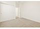 Bedroom featuring a closet and neutral carpet at 16015 W Desert Hollow Dr, Surprise, AZ 85387