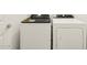 Conveniently located laundry room featuring a new washer and dryer at 16015 W Desert Hollow Dr, Surprise, AZ 85387