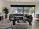 Comfortable living room featuring a large sectional, two chairs, and an outdoor view at 4235 E Turney Ave, Phoenix, AZ 85018