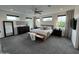Spacious main bedroom features plush carpeting, ample natural light, and modern decor at 4235 E Turney Ave, Phoenix, AZ 85018