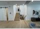 Modern staircase featuring sleek black railings and light wood steps at 4235 E Turney Ave, Phoenix, AZ 85018