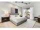 Serene bedroom featuring a king-size bed, modern lighting, and access to a private outdoor patio at 100 W Northern Ave # 6, Phoenix, AZ 85021