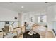 Comfortable living area with plush seating, overlooking a staircase and window with natural light at 100 W Northern Ave # 6, Phoenix, AZ 85021
