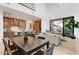 Bright, open-concept living space with high ceilings, a modern kitchen, dining area, and seamless indoor-outdoor flow at 100 W Northern Ave # 6, Phoenix, AZ 85021