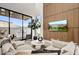 Inviting living room with a large sliding glass door to outdoor patio, comfortable seating and TV at 100 W Northern Ave # 6, Phoenix, AZ 85021