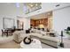 Open-concept living space showcasing stylish furnishings and decor, with views of the kitchen and dining areas at 100 W Northern Ave # 6, Phoenix, AZ 85021
