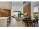 Bright, open-concept living and dining area with sleek hardwood floors, soaring ceilings, and contemporary design at 100 W Northern Ave # 6, Phoenix, AZ 85021