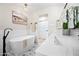 Bright bathroom features double sinks, white countertop, free standing tub, and tile floors at 1012 E Magdalena Dr, Tempe, AZ 85283