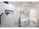 Beautiful bathroom with shower, free standing tub, tile floors, and inset shelving at 1012 E Magdalena Dr, Tempe, AZ 85283