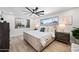 Tranquil main bedroom featuring a serene color palette, wood flooring, and a large window at 1012 E Magdalena Dr, Tempe, AZ 85283