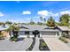 A well-manicured home with lush landscaping under a beautiful blue sky at 1012 E Magdalena Dr, Tempe, AZ 85283