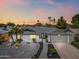 A well-manicured home with desert landscaping under a vibrant sunset sky at 1012 E Magdalena Dr, Tempe, AZ 85283