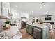 Spacious kitchen with an island flows into the living room, offering open-concept living at 1012 E Magdalena Dr, Tempe, AZ 85283