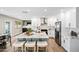 Bright kitchen boasts a large island with seating, stainless steel appliances, and white cabinets at 1012 E Magdalena Dr, Tempe, AZ 85283