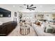 Bright living room with hardwood floors, neutral color palette, stylish sofas, and seamless access to the pool at 1012 E Magdalena Dr, Tempe, AZ 85283