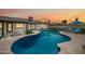 Beautiful backyard featuring a sparkling pool, artificial turf, and comfortable lounge chairs at 1012 E Magdalena Dr, Tempe, AZ 85283