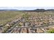 Panoramic aerial shot of a sprawling neighborhood against a desert landscape with scenic mountains in the background at 10792 W Whitehorn Way, Peoria, AZ 85383