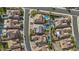 An aerial view of houses with pools and well-manicured landscapes in a suburban neighborhood at 10792 W Whitehorn Way, Peoria, AZ 85383