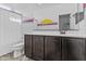 Quaint bathroom with vanity, tile flooring, and a shower curtain at 10792 W Whitehorn Way, Peoria, AZ 85383