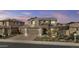 Beautiful home features a neutral color palette, brick driveway, three car garage and professionally designed desert landscaping at 10792 W Whitehorn Way, Peoria, AZ 85383