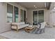 Cozy outdoor patio featuring comfortable seating, stylish decor, and inviting ambiance at 10792 W Whitehorn Way, Peoria, AZ 85383