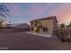 Two story home with solar panels, balcony, and gravel backyard at 10866 S Dreamy Dr, Goodyear, AZ 85338