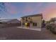 Two story home with solar panels, balcony, and gravel backyard at 10866 S Dreamy Dr, Goodyear, AZ 85338