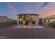 Two story home with solar panels, balcony, and gravel backyard at 10866 S Dreamy Dr, Goodyear, AZ 85338