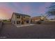 Two story home with solar panels, balcony, and gravel backyard at 10866 S Dreamy Dr, Goodyear, AZ 85338