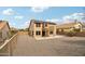 Spacious backyard featuring a second-story balcony, and a covered patio and gravel groundcover at 10866 S Dreamy Dr, Goodyear, AZ 85338