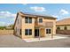 Backyard featuring a second-story balcony, solar panels, and a covered patio at 10866 S Dreamy Dr, Goodyear, AZ 85338