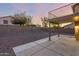 Wide backyard with neutral gravel and spacious patio deck at 10866 S Dreamy Dr, Goodyear, AZ 85338