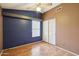 Bedroom features a ceiling fan, window with blinds, and a closet with sliding doors at 10866 S Dreamy Dr, Goodyear, AZ 85338