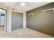 Neutral bedroom featuring carpet, a ceiling fan, closet, and shelving at 10866 S Dreamy Dr, Goodyear, AZ 85338